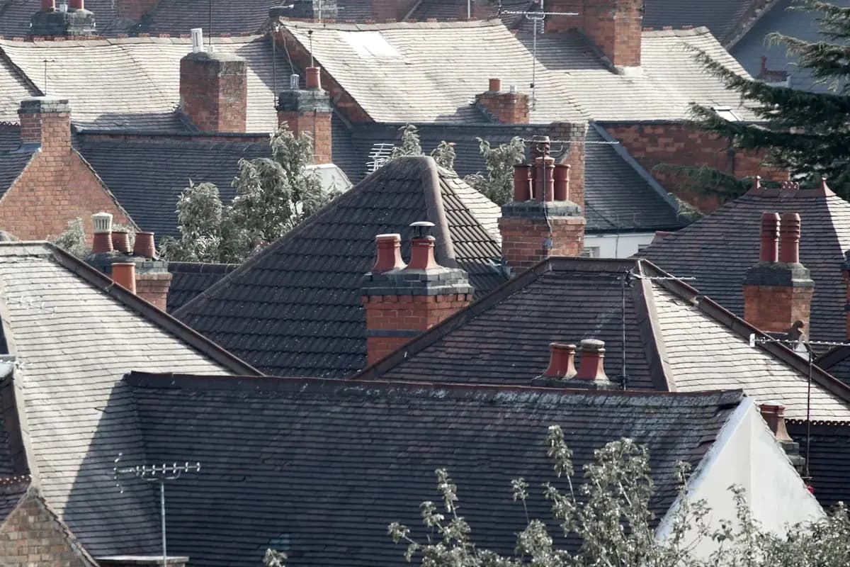 Pitched roofs and chimneys of closely packed houses