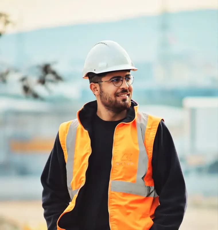 Drainage engineer in a hard hat and hi-vis jacket