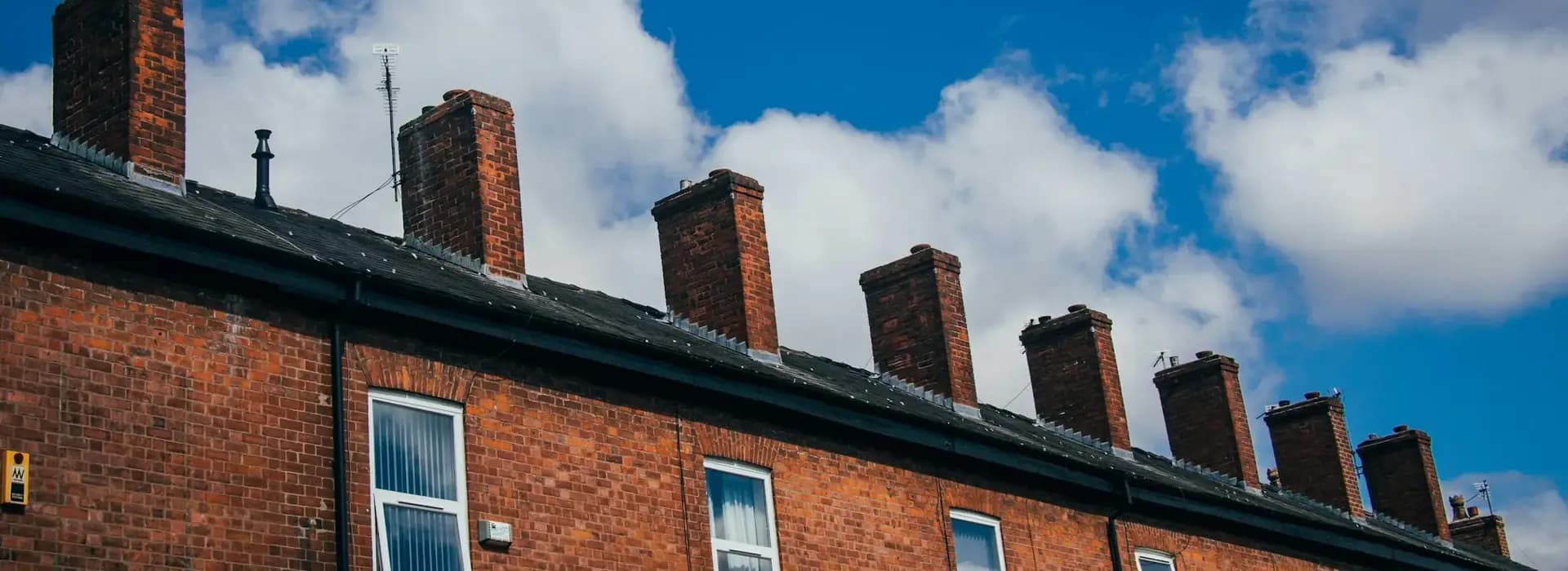 Row of red-brick terraced houses