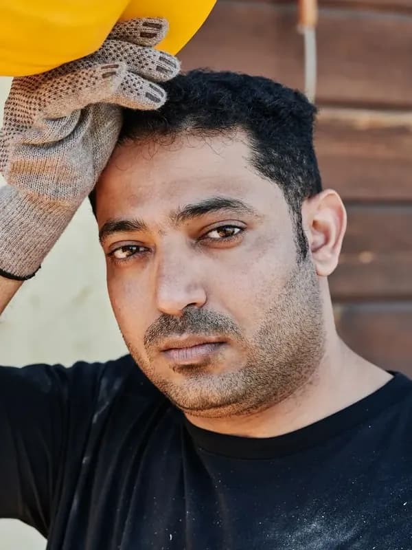 Engineer holding a hard hat (placeholder photo)