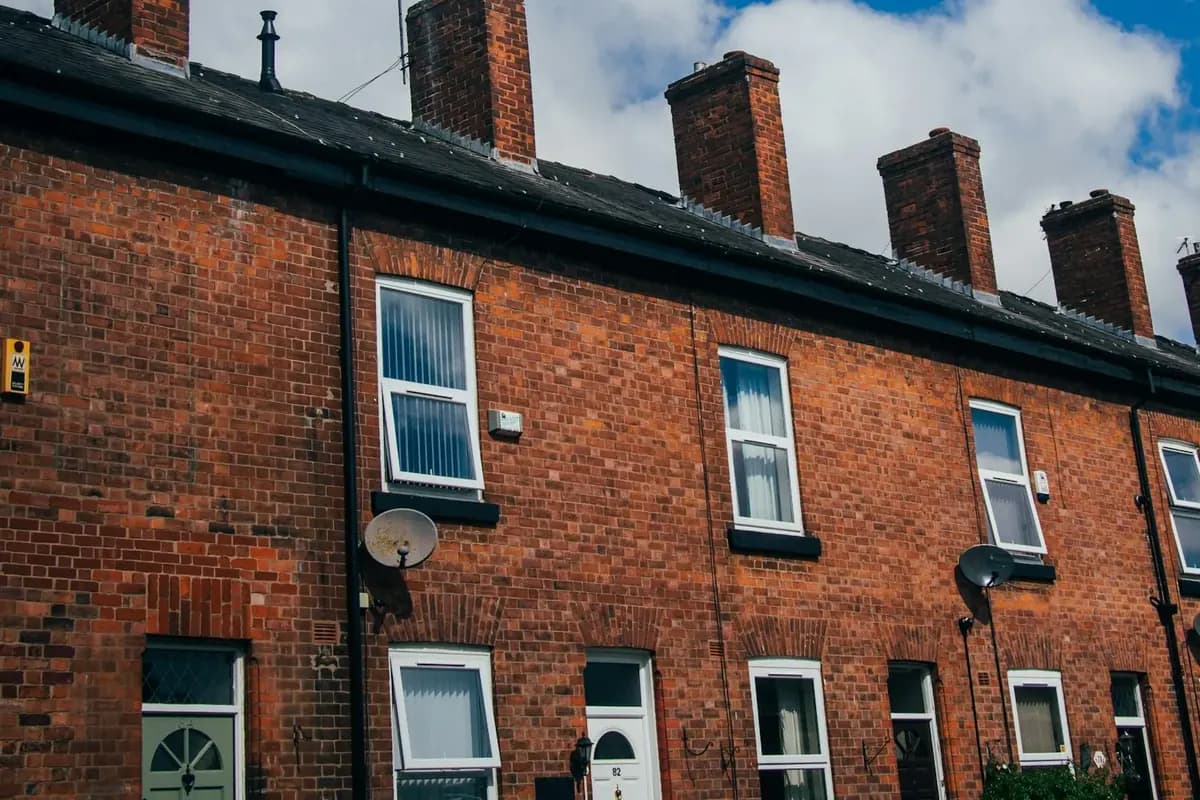 Red-brick terraced houses with sash-style windows